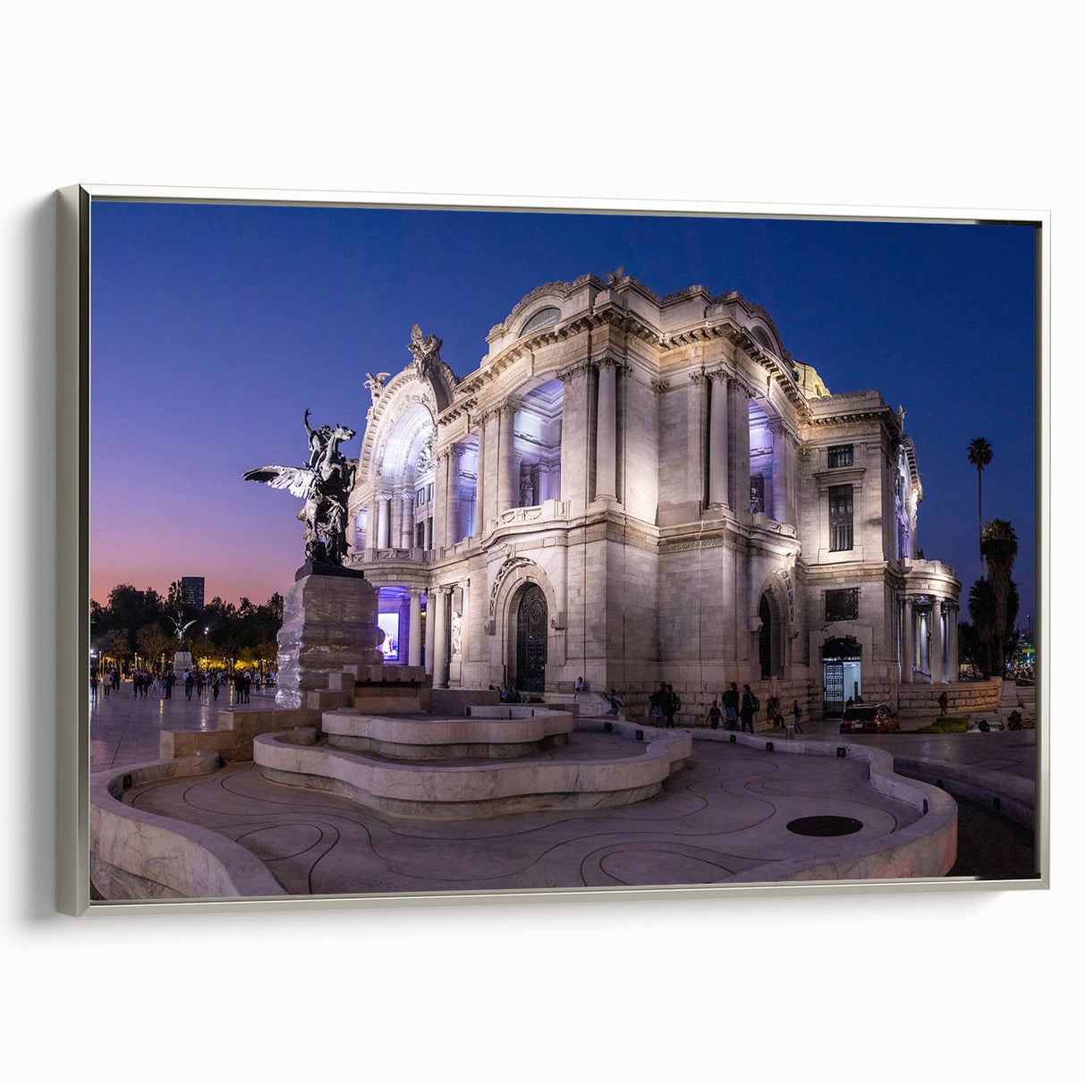 Framed canvas of a vintage Mexico City landscape painting featuring colorful buildings and a black sky.