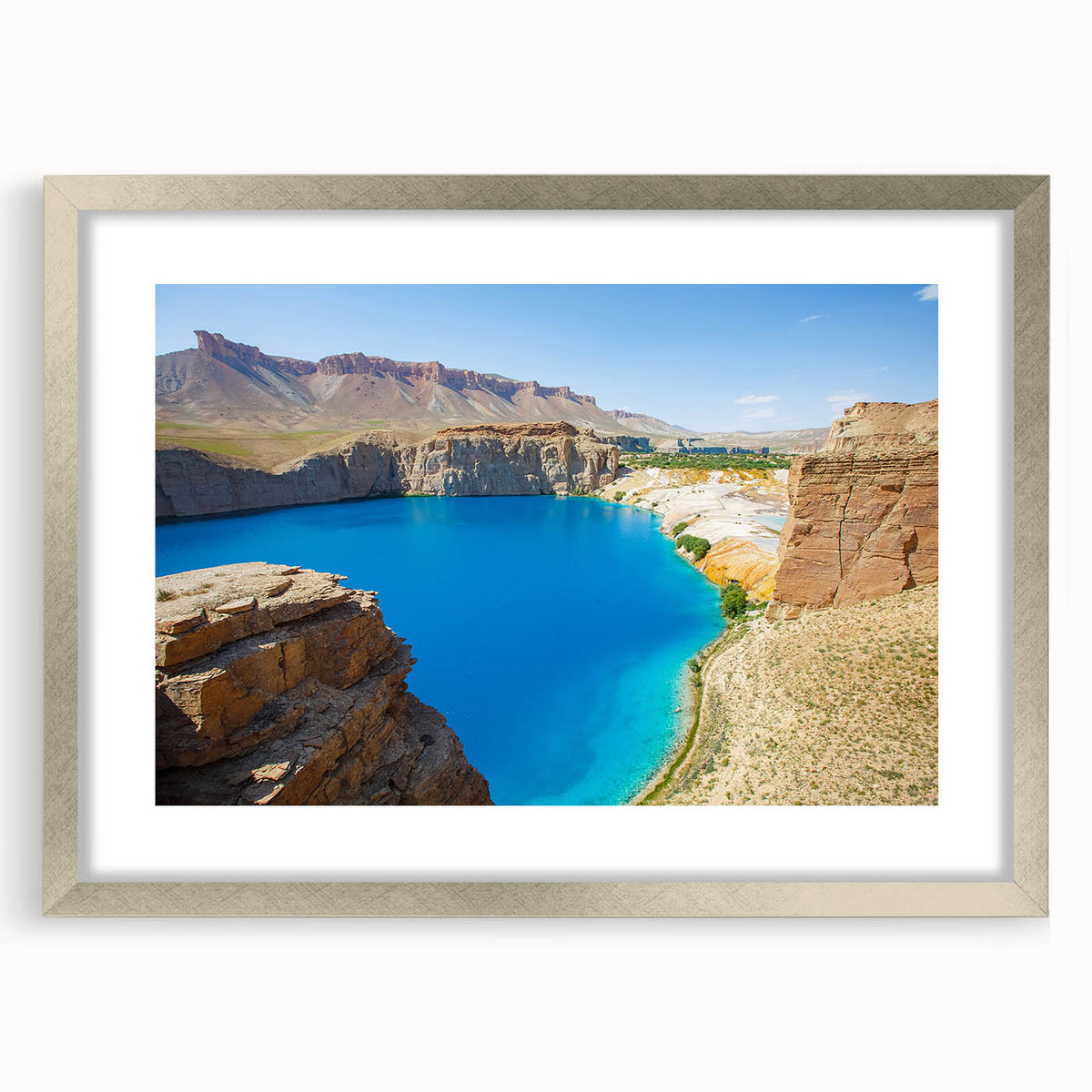 Textured abstract art print depicting a Middle Eastern scenery in muted earth tones on a framed silver mat.