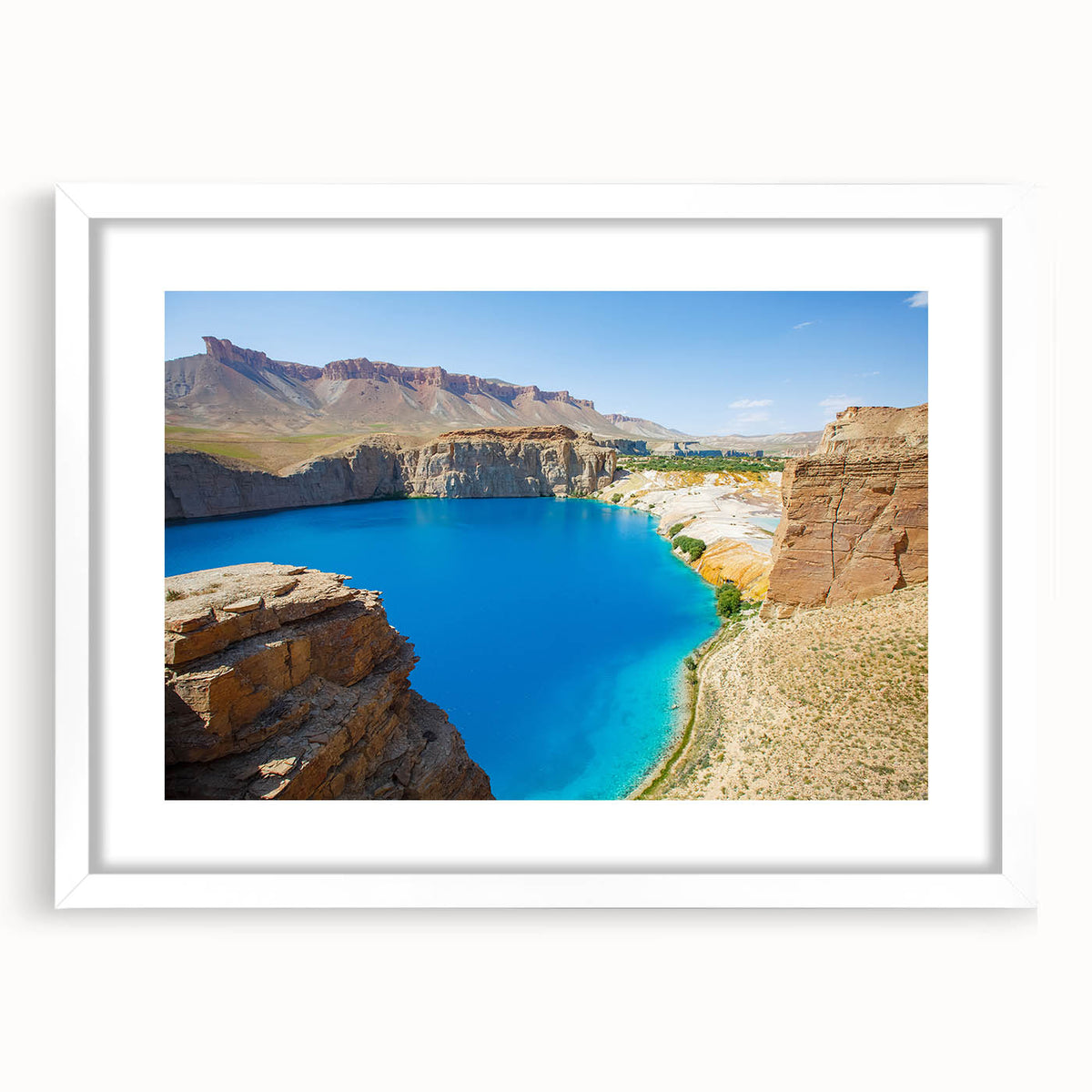 Abstract art print depicting a Middle Eastern landscape in muted earth tones on a framed white mat.