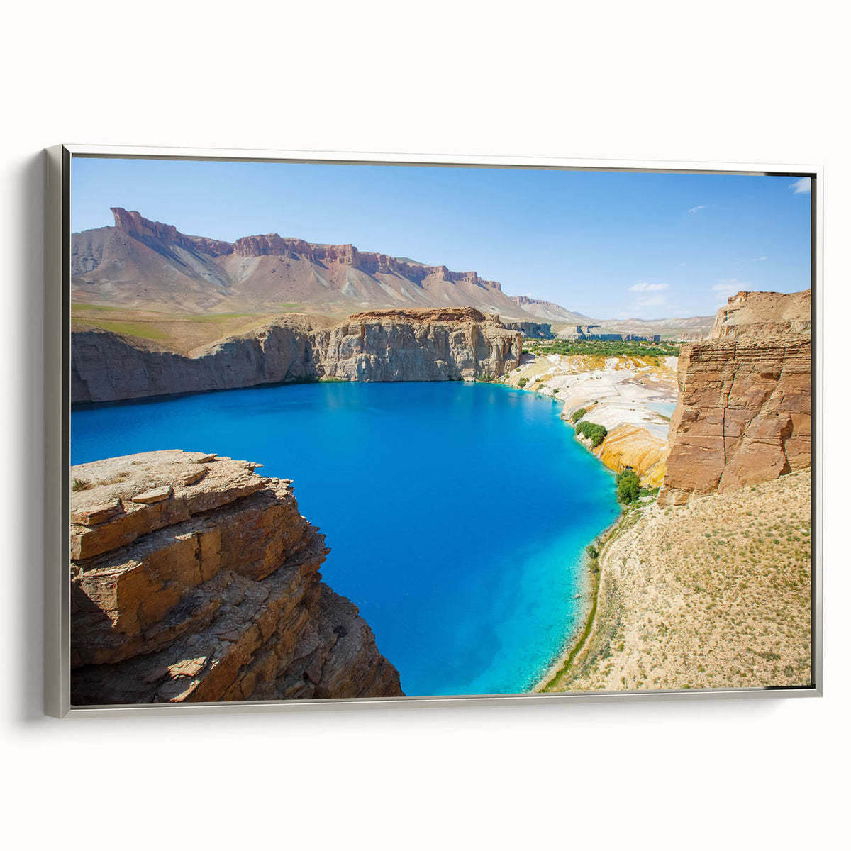 Framed canvas featuring a vintage-style landscape painting of an Afghan scenery in muted earth tones.