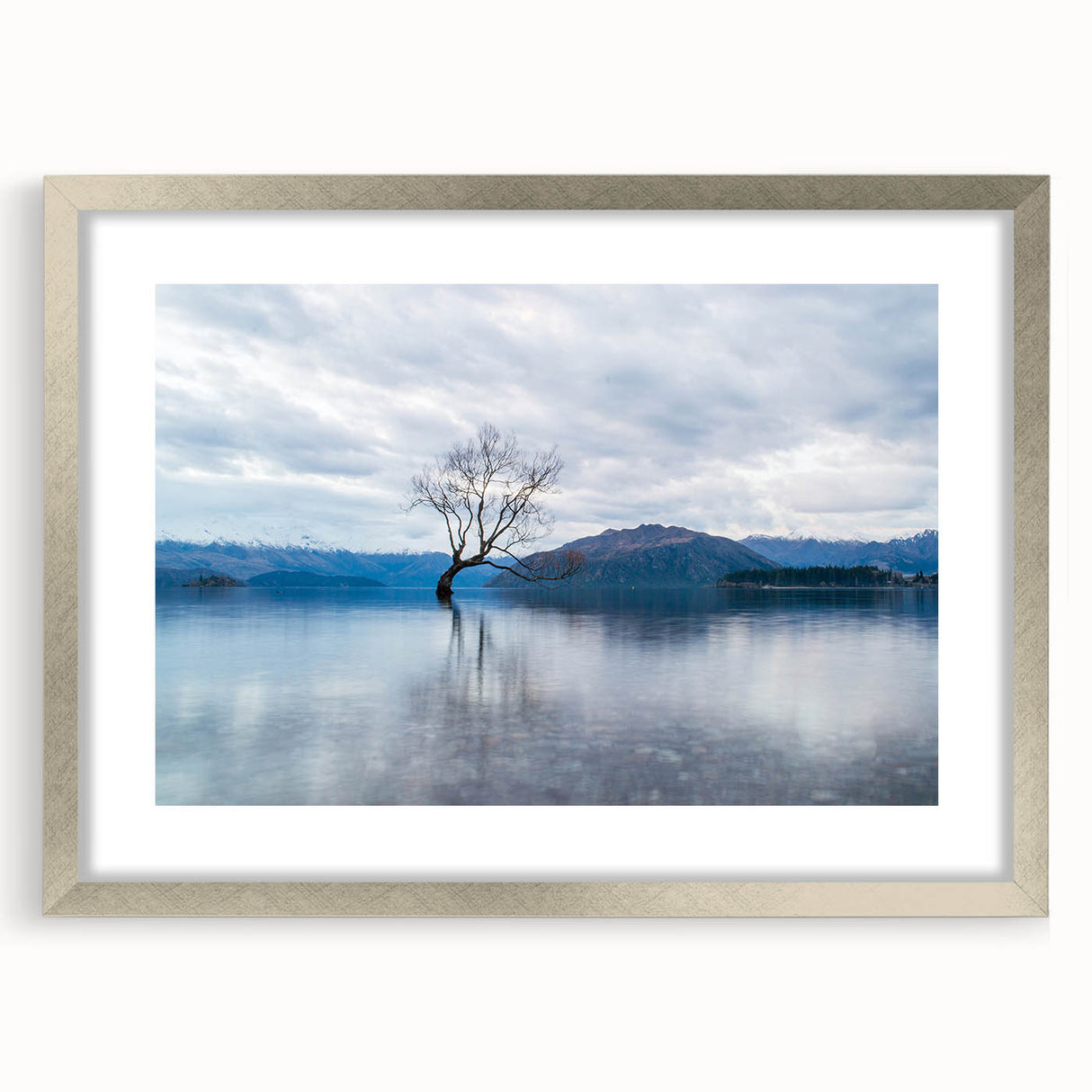 Textured abstract art print depicting a serene Otago, New Zealand landscape in muted earth tones, framed in silver.
