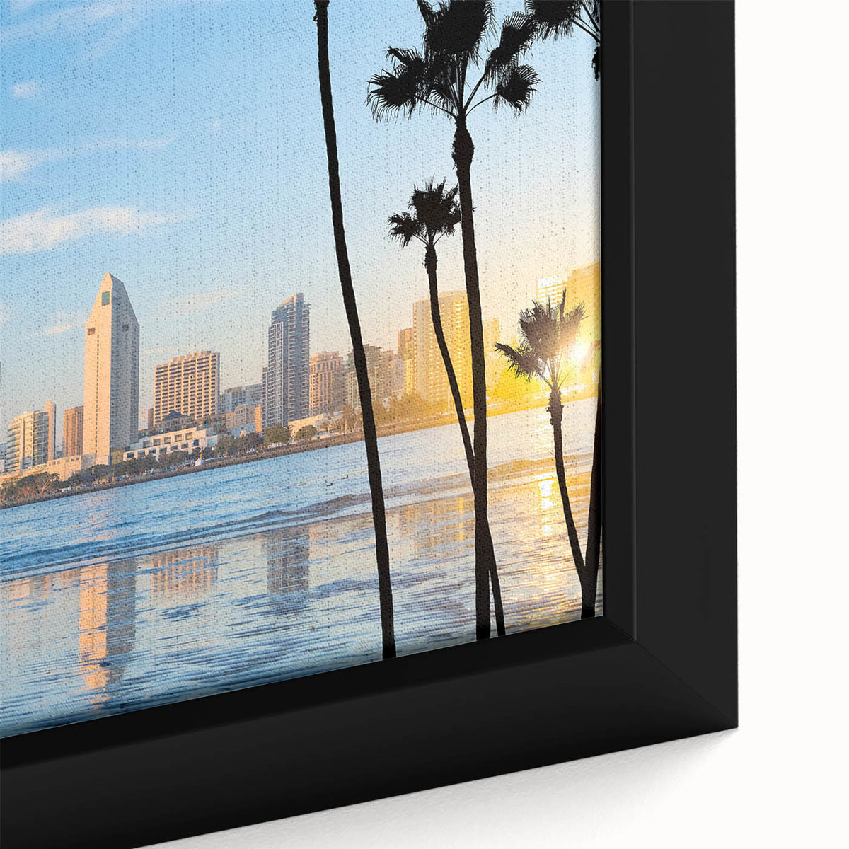Close-up of a black framed canvas depicting colorful, textured scenery of Coronado, California.