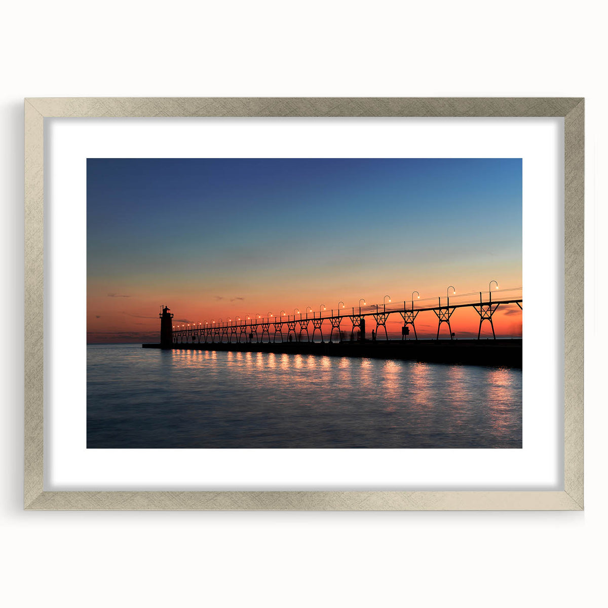 Textured abstract art print depicting Lake Michigan, using muted blue and gray tones, framed in silver.