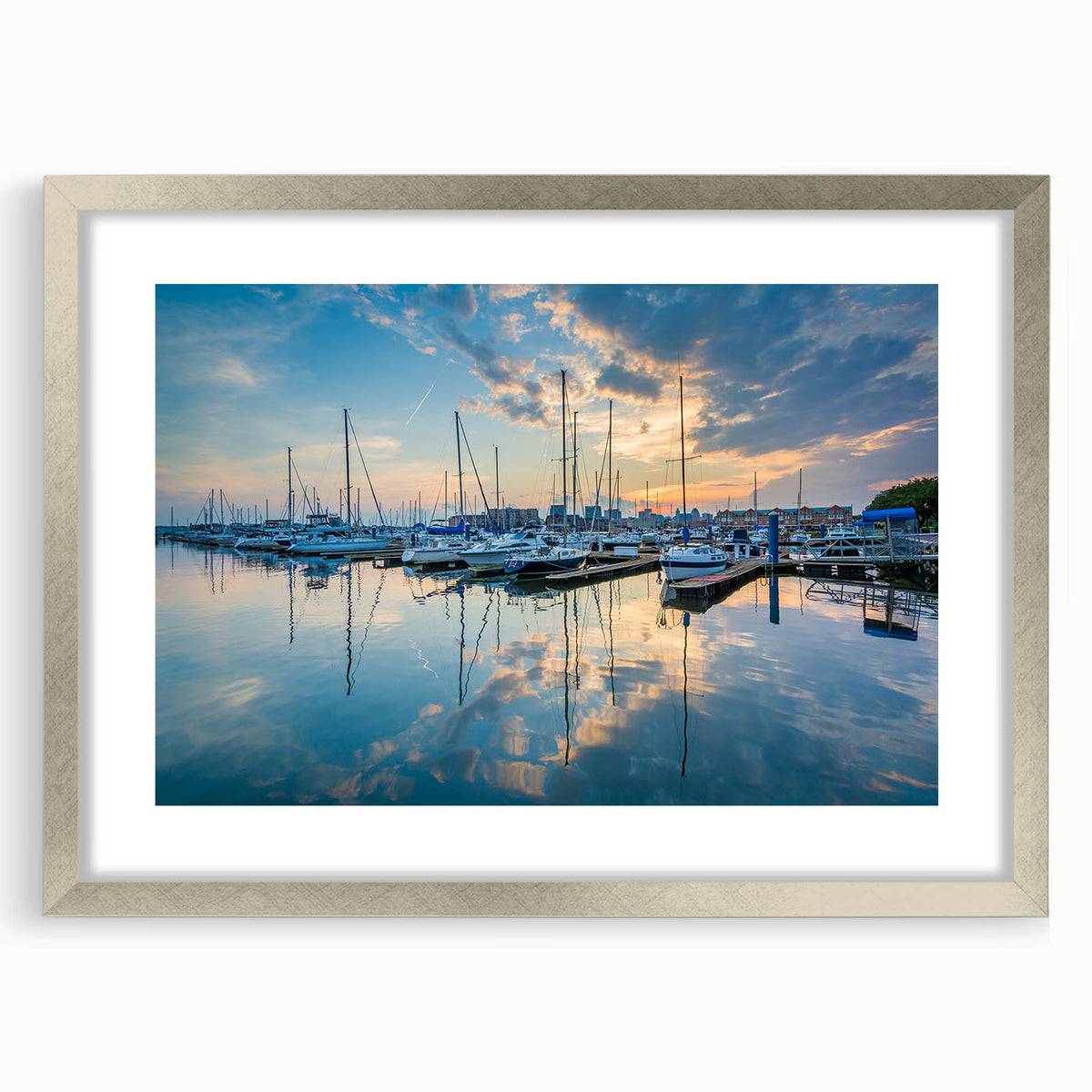 Textured abstract art print of Baltimore skyline in muted gray tones, framed in silver, ideal for bedroom wall decor.
