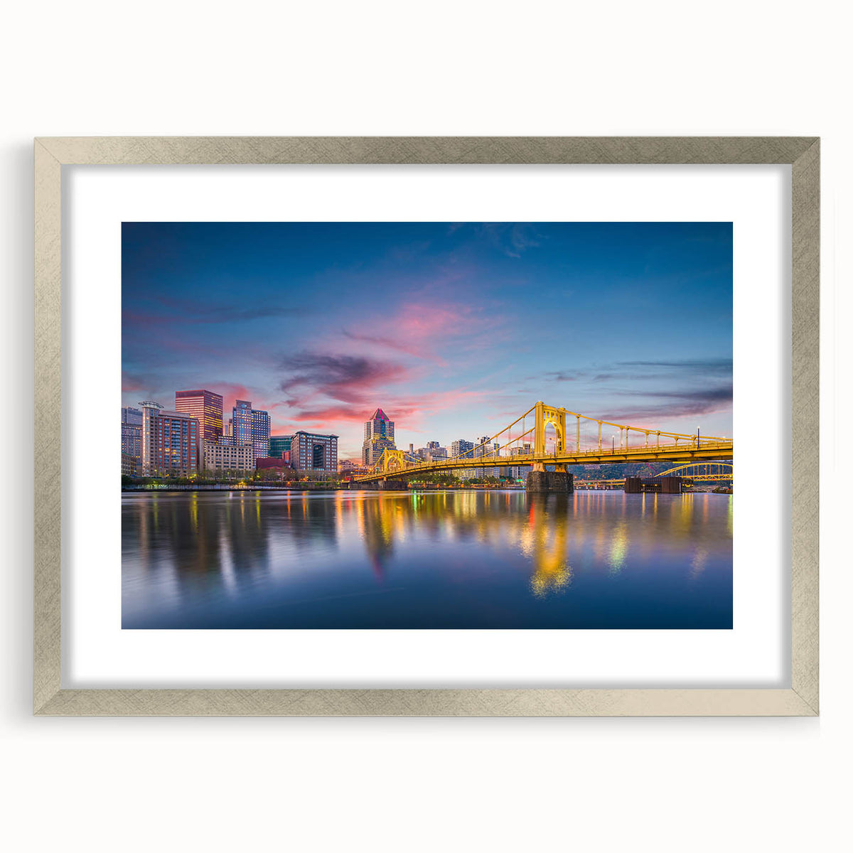 Textured art depicting abstract Pittsburgh skyline in muted grays and blues on a framed silver mat.