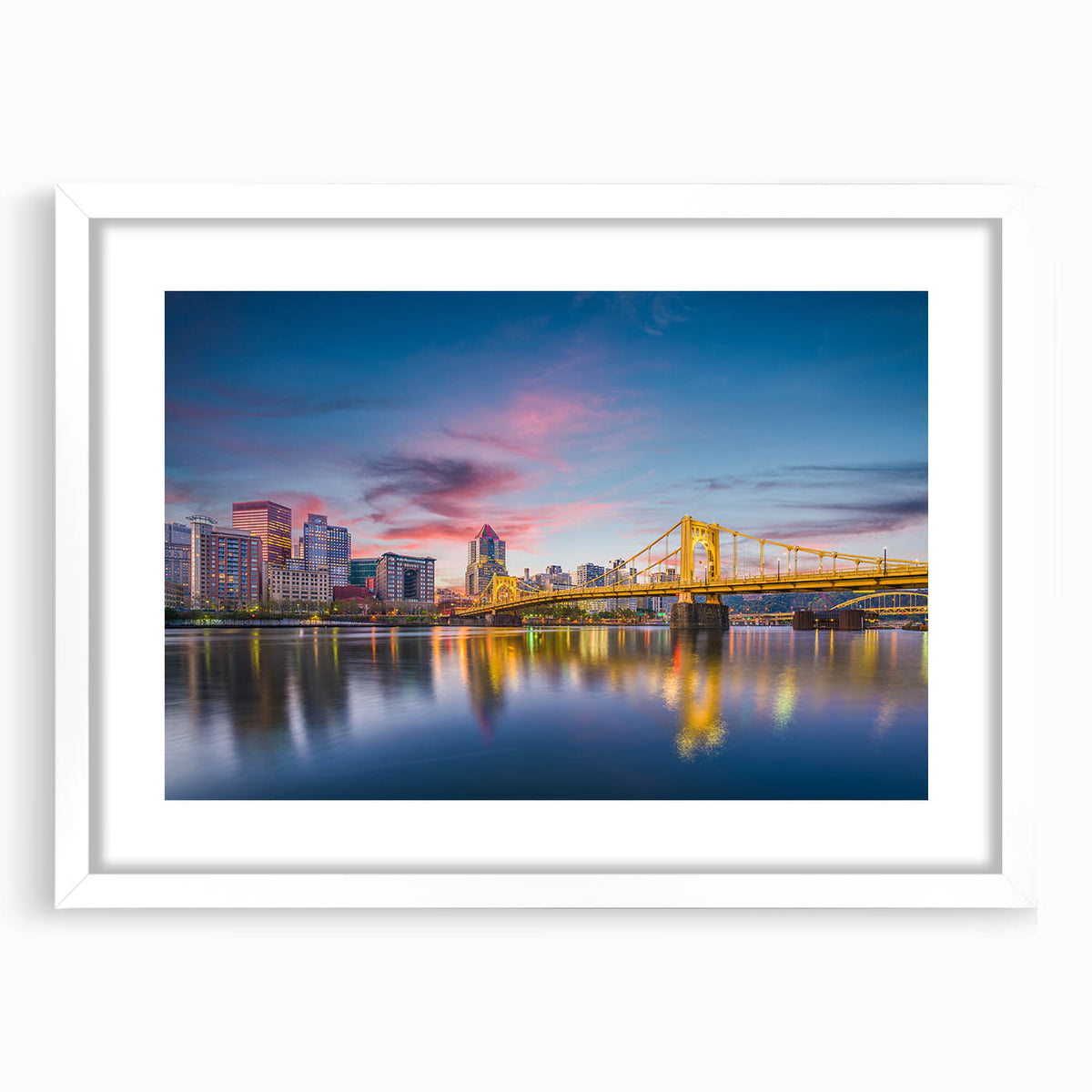 Abstract art print of Pittsburgh skyline in muted gray and blue tones on a framed white mat, suitable for dining room decor.