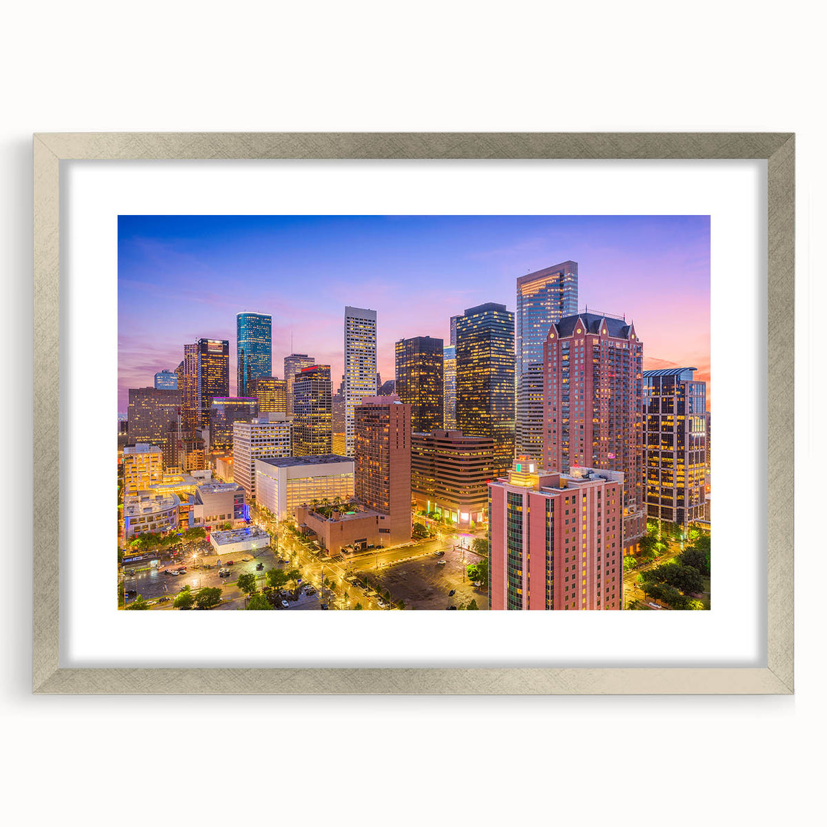 Textured art print of abstract Houston skyline in muted gray tones on a silver-framed mat, suitable for bedroom decor.