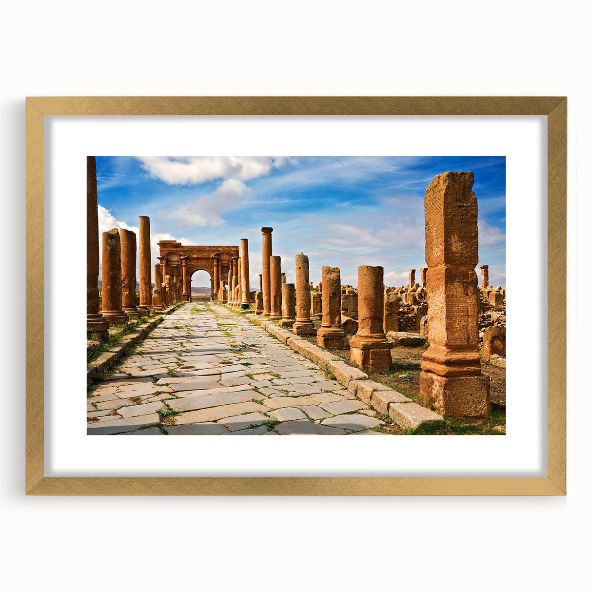Abstract textured art print of Algerian scenery in muted earth tones, framed in gold, ideal for bedroom art.