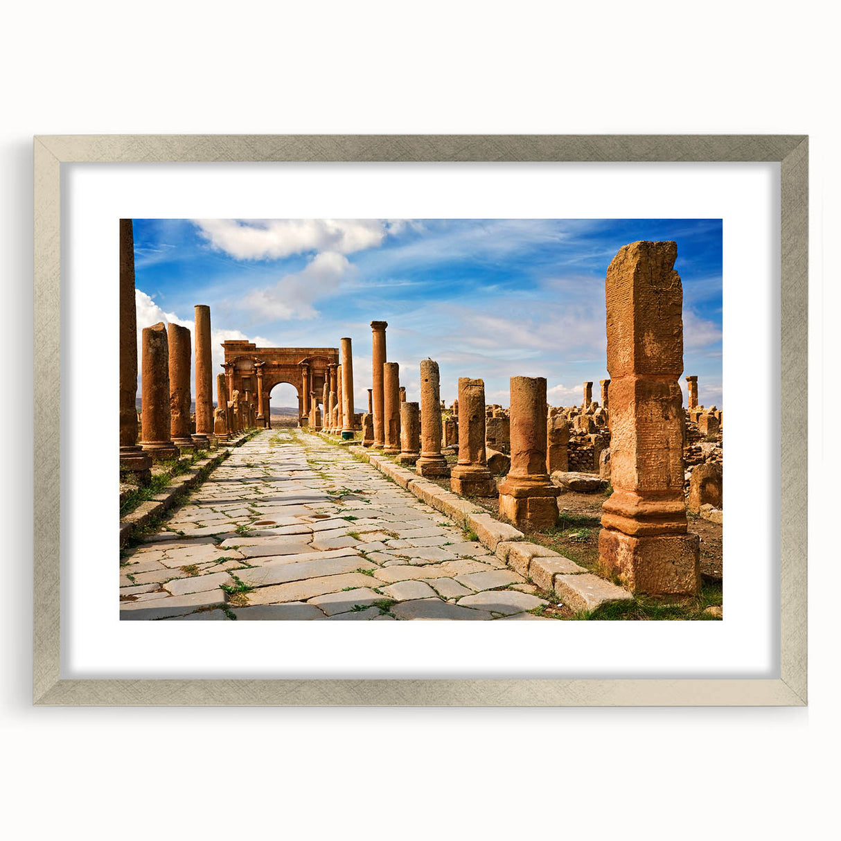 Abstract art print of an Algerian landscape in muted earth tones on a framed silver mat, suitable for dining room decor.