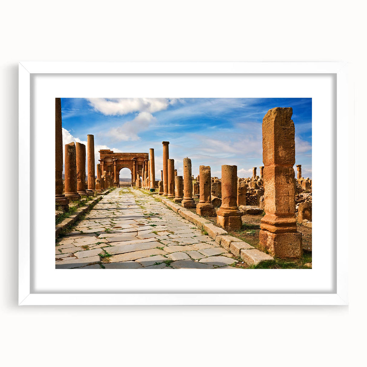 Extra large abstract art print depicting textured scenery of Algeria, in muted earth tones on a white framed canvas.