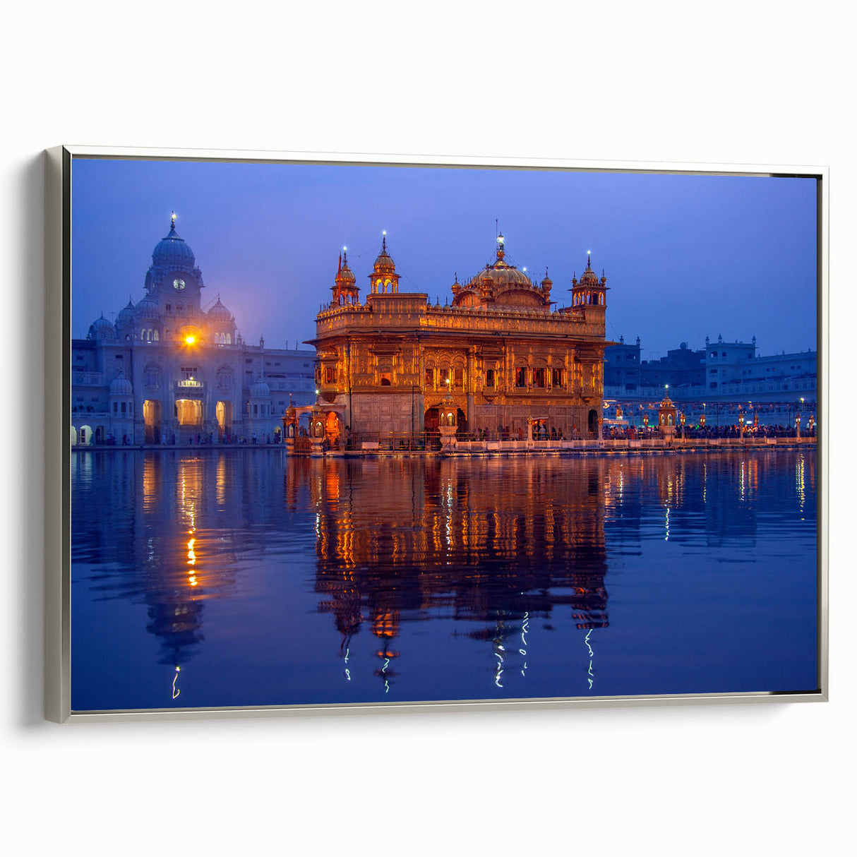 Framed canvas featuring a vintage-style landscape art painting of an Indian scenery in colorful hues.