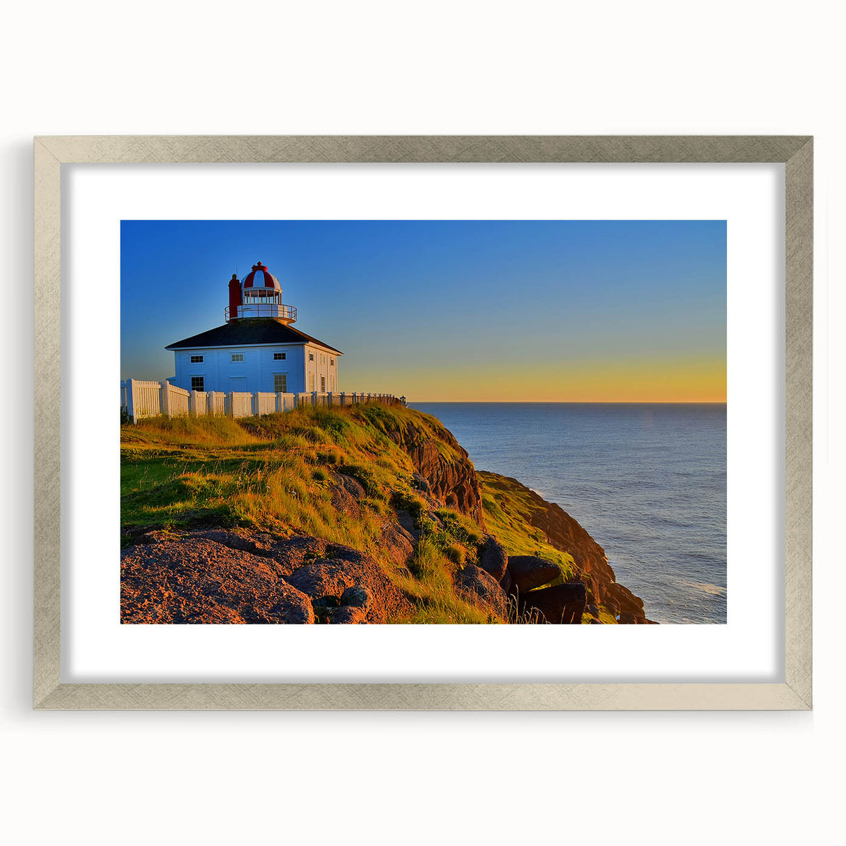 Textured art print of Newfoundland scenery in abstract style, featuring muted earth tones, framed in silver.