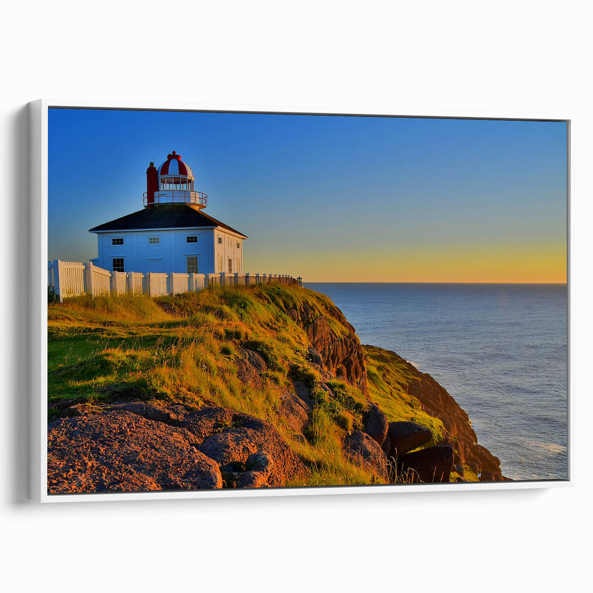 Framed canvas of vintage poster art depicting colorful Newfoundland scenery, ideal for living room decor.