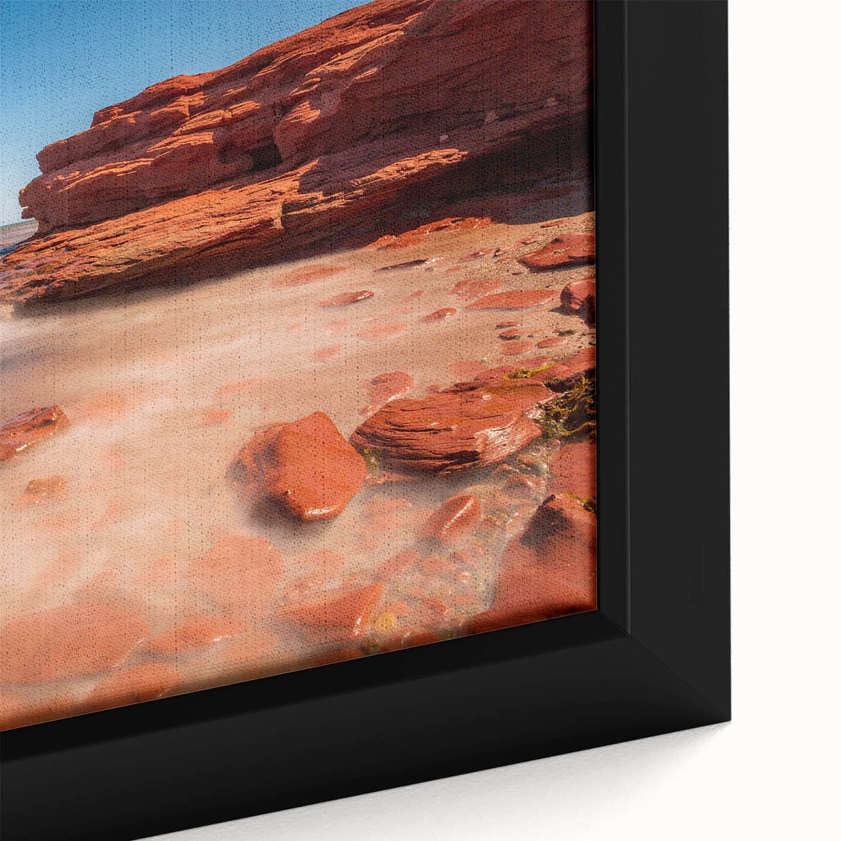 Close-up of a textured, black wall art featuring a colorful Prince Edward, Canada scenery on a framed canvas.