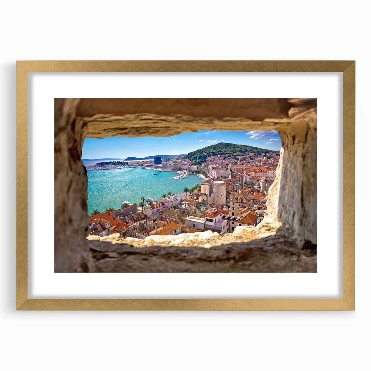 Extra large wall art depicting an abstract European scenery in textured hues of blue and gold, framed in gold.