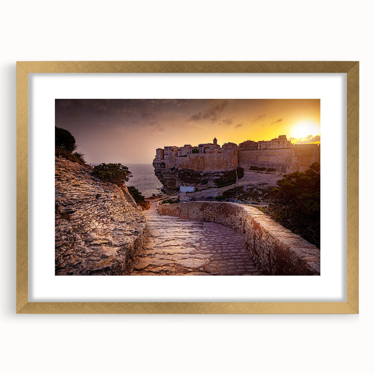 Abstract art print of a Corsican landscape in muted earth tones on a framed gold mat, ideal for dining room decor.