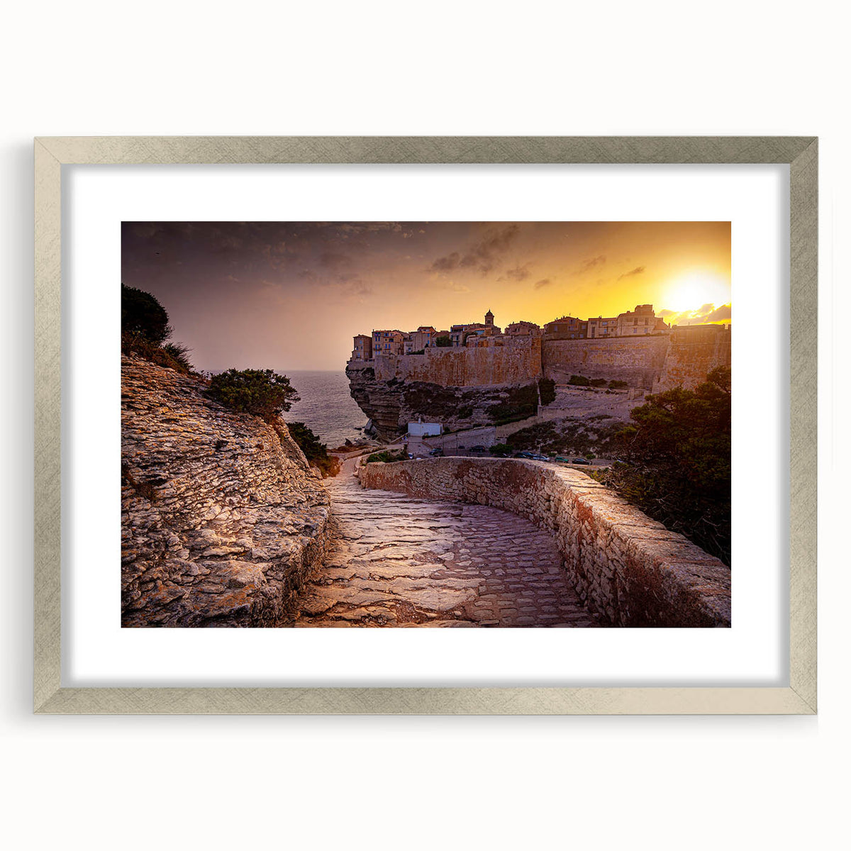 Extra large abstract art print of a Corsican landscape in textured grays and blues, framed in silver.