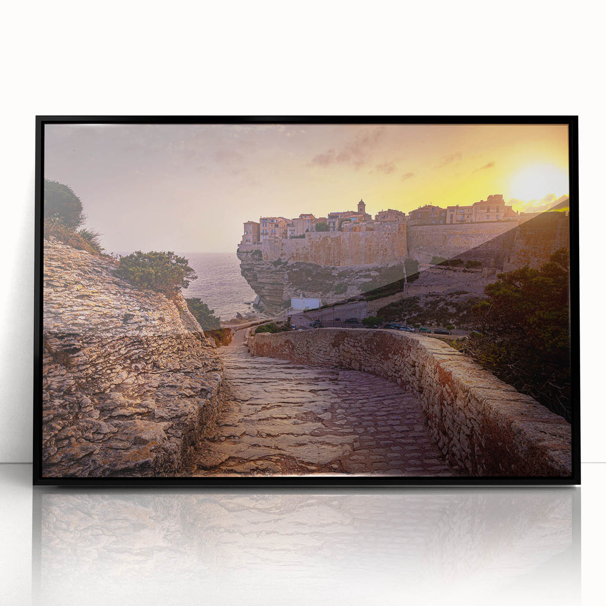 Large abstract wall art depicting a Corsican landscape in muted earth tones, framed in black acrylic.