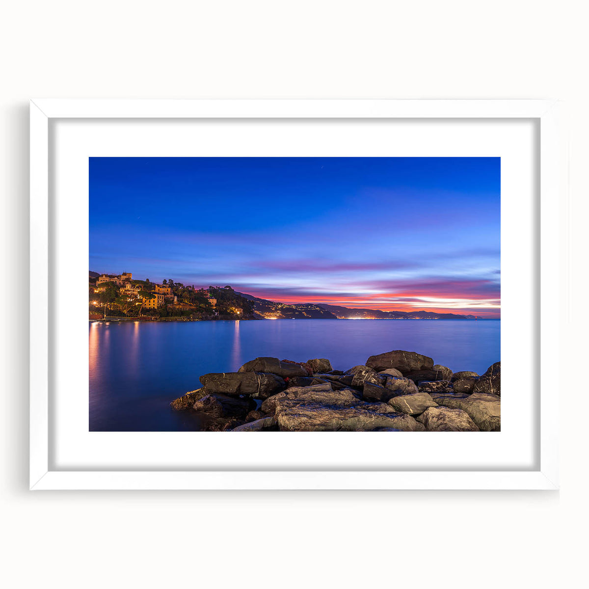 Abstract art print of Portofino, Italy in vibrant blue and green hues on a white framed canvas, ideal for dining room decor.