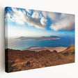 Large canvas print of a serene Spanish Canary Island landscape, featuring soft blue sky and lush greenery.