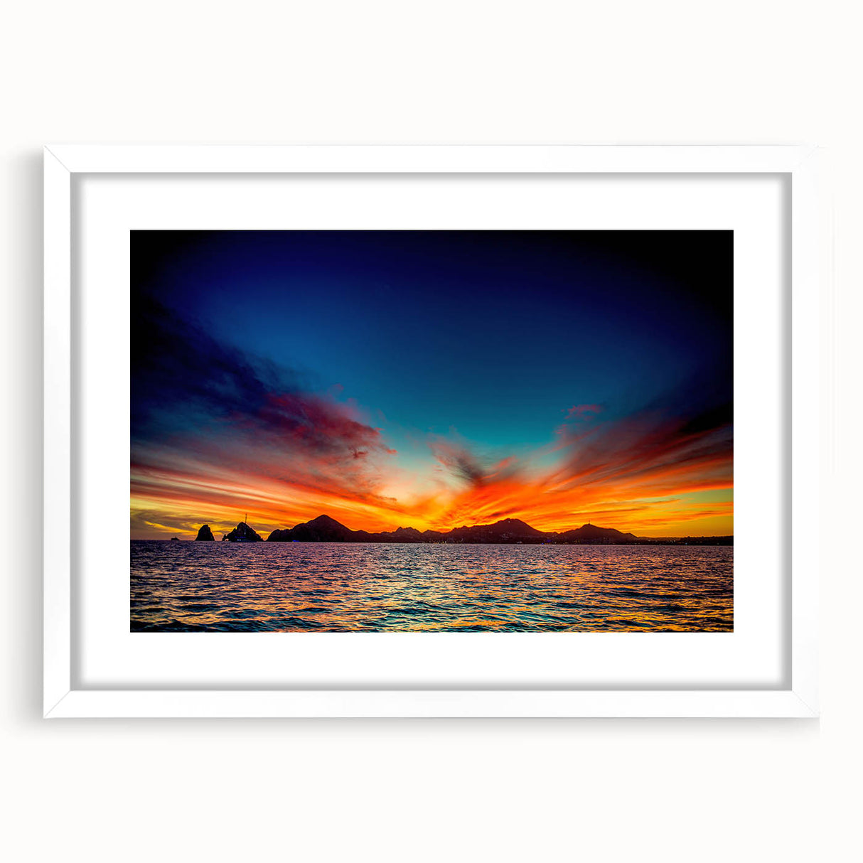 Abstract art print of Cabo San Lucas scenery in muted blue and white tones, framed with a white mat.