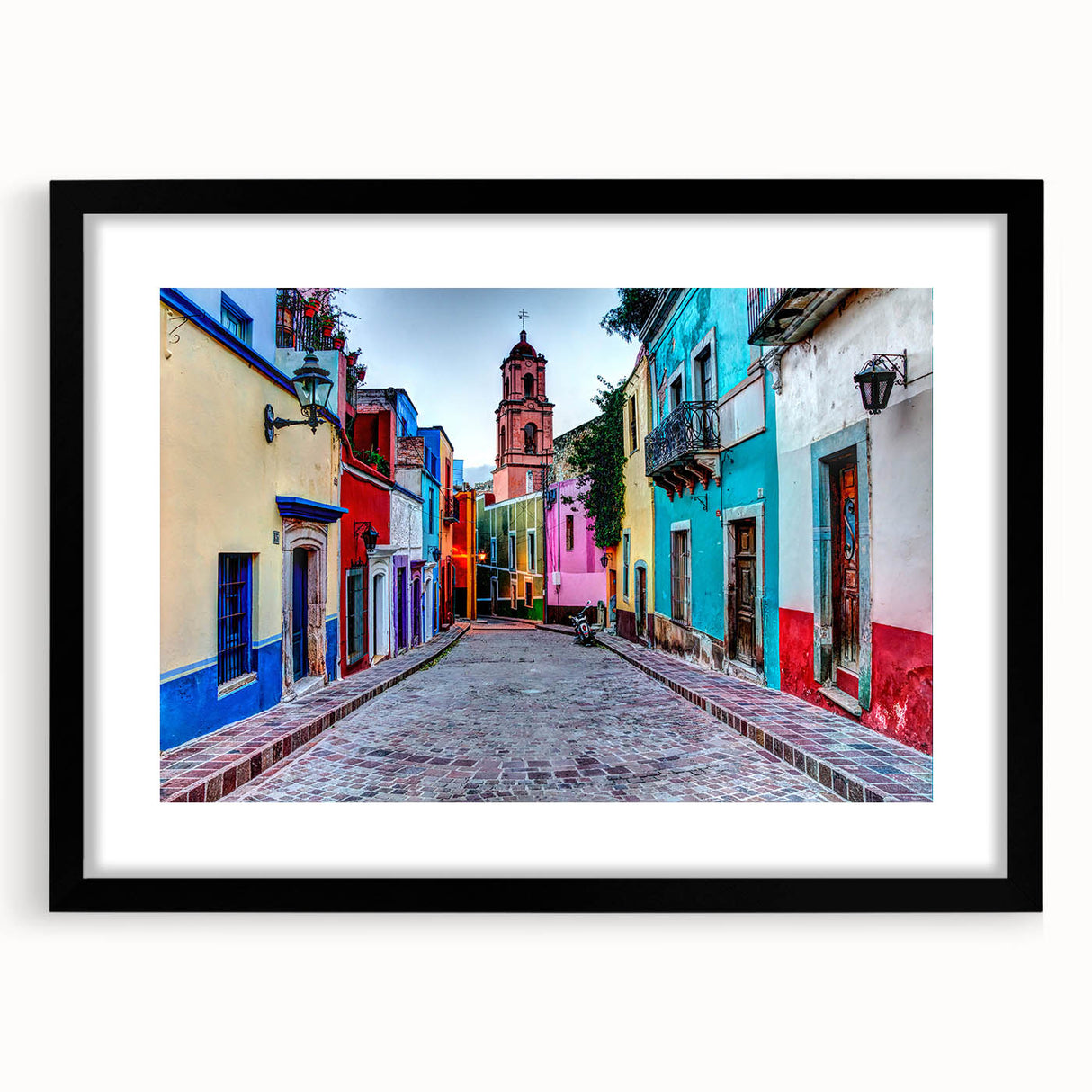 Abstract art print of Guanajuato scenery in vibrant colors on a textured, extra large canvas, framed in black.