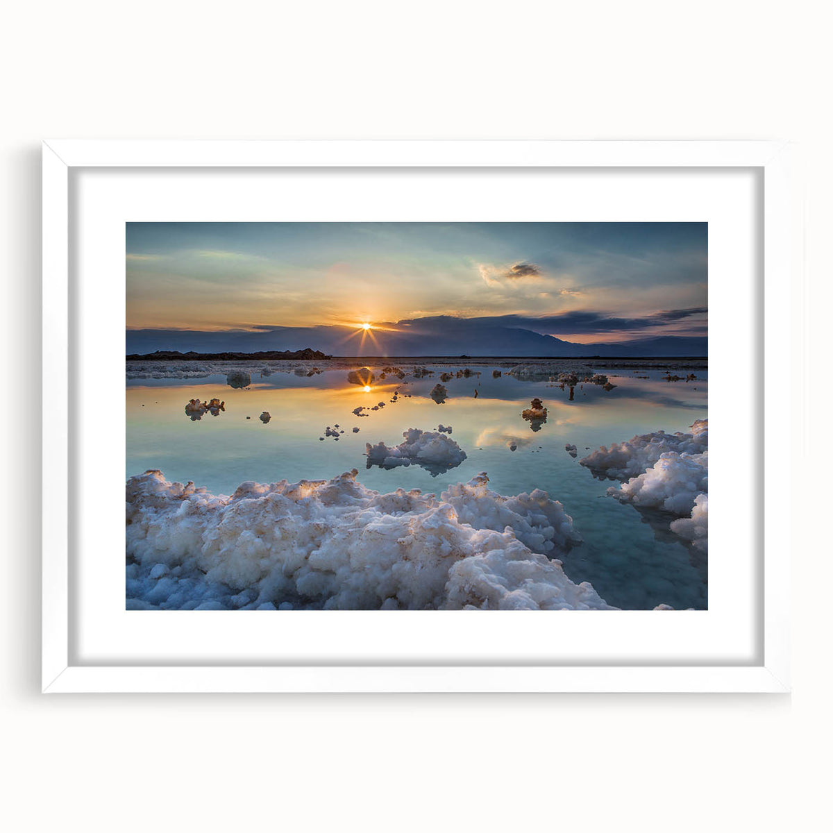 Abstract art print of the Dead Sea in muted blues and grays, framed with a white mat.