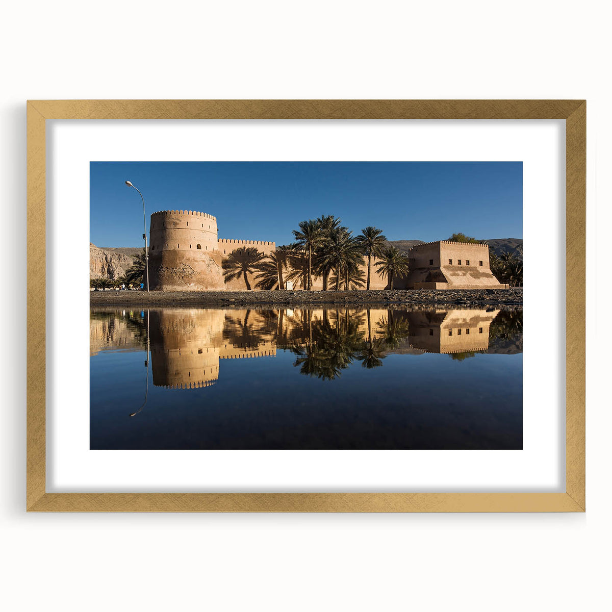 Extra large wall art depicting an abstract Middle Eastern scenery in textured gold and earth tones.