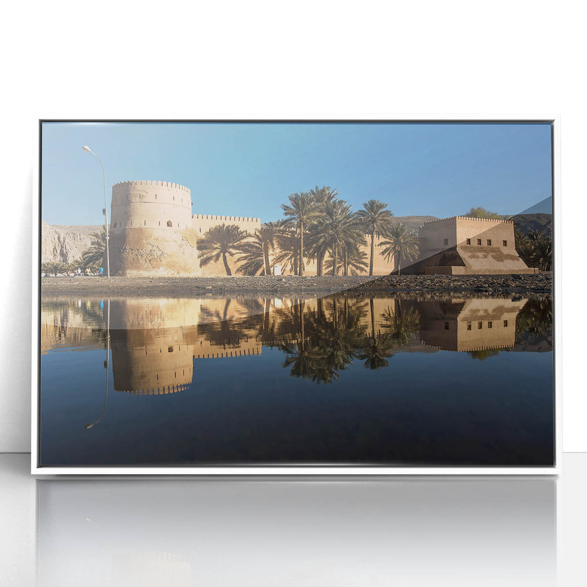 Acrylic print of a Middle Eastern landscape in muted earth tones, framed in white, suitable for modern art wall decor.