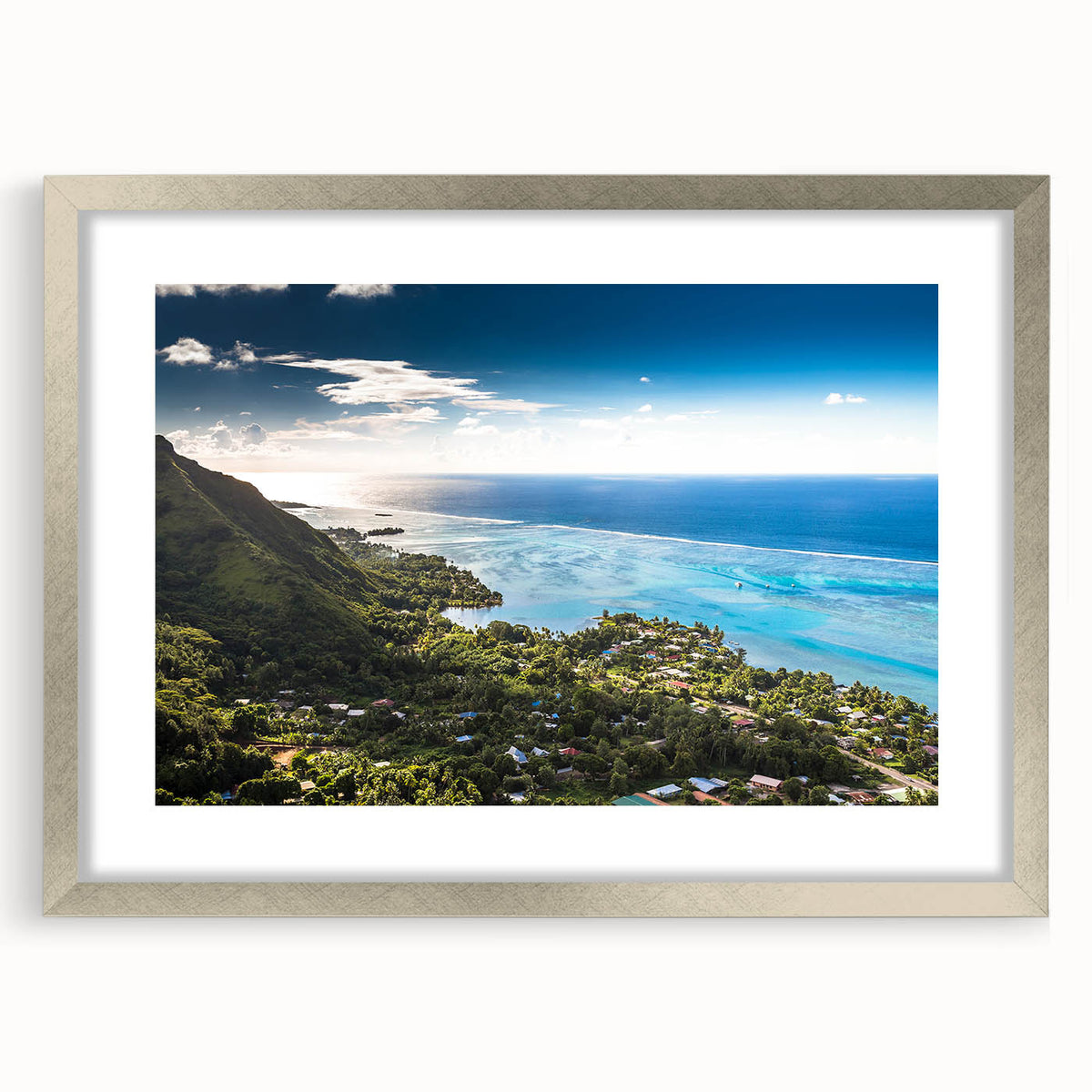 Textured art print featuring abstract oceanic shapes in cool blue and green tones, framed in silver, ideal for bedroom art.