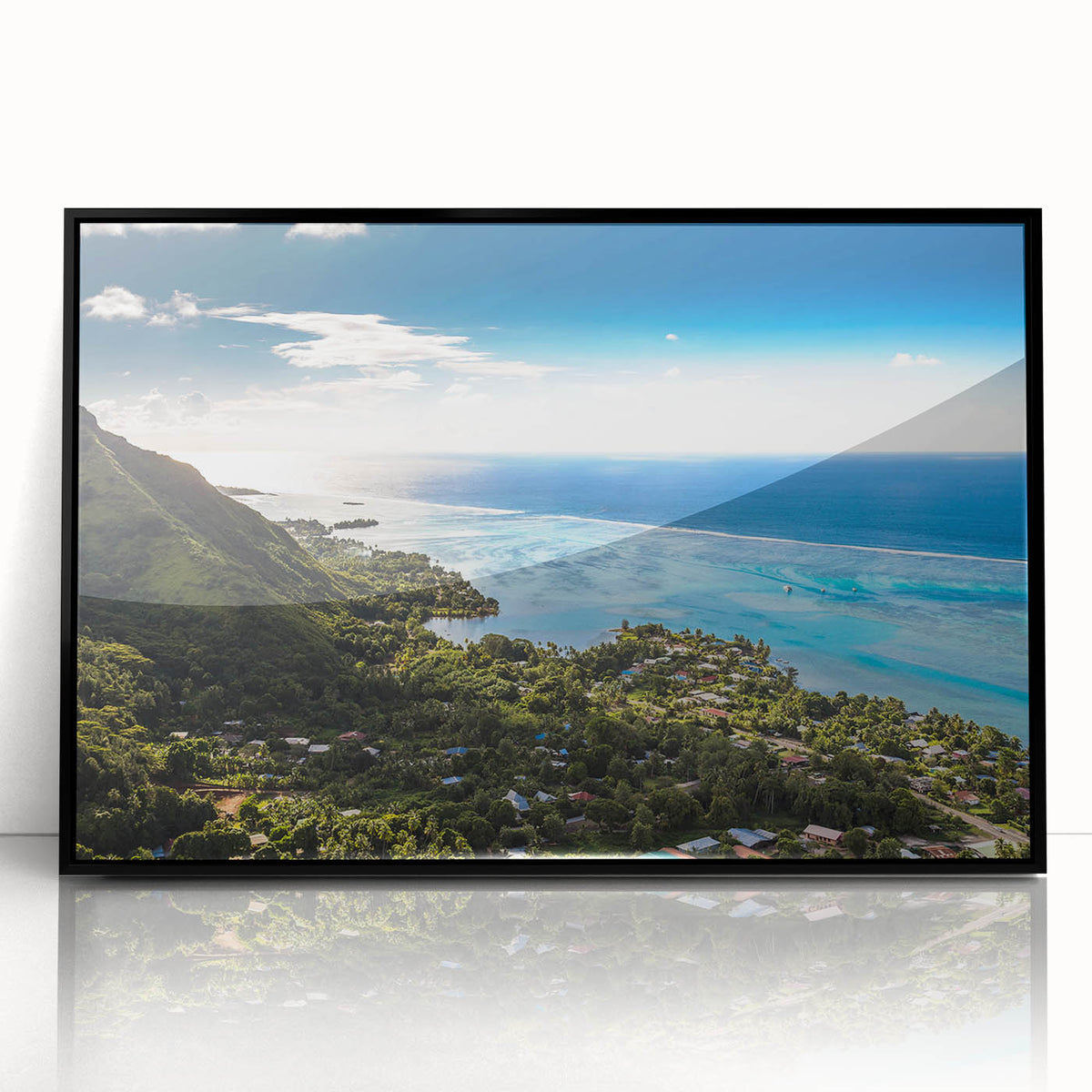 Large abstract wall art of a Tahitian landscape in muted blues and greens, framed in black acrylic.