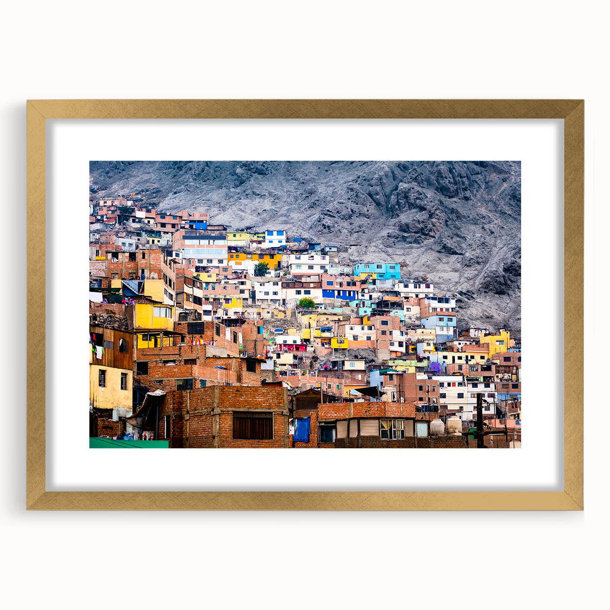 Extra large abstract art print of a textured South American scenery in muted earth tones, framed in gold.