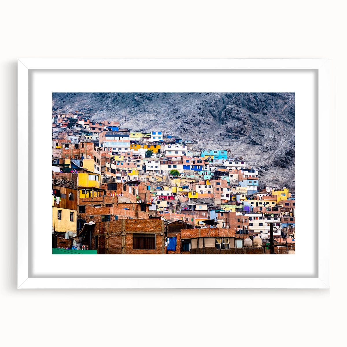 Abstract art print of a stylized South American landscape in muted earth tones, framed with a white mat.