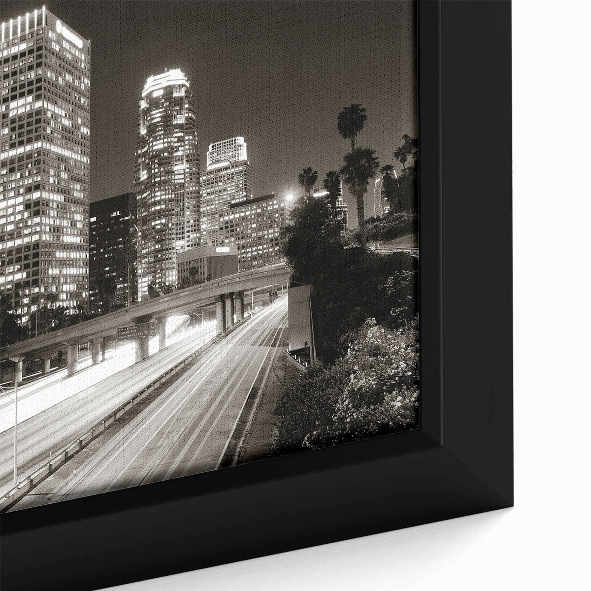 Extra large framed canvas of a textured Los Angeles skyline in black with colorful accents, ideal for living room decor.