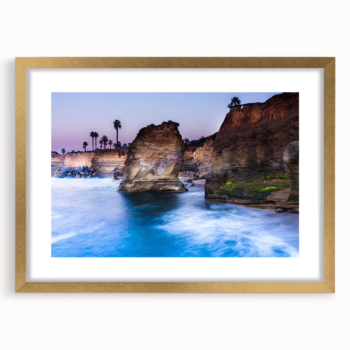 Extra large abstract art print depicting San Diego scenery in textured hues of blue and gold, framed with a gold mat.