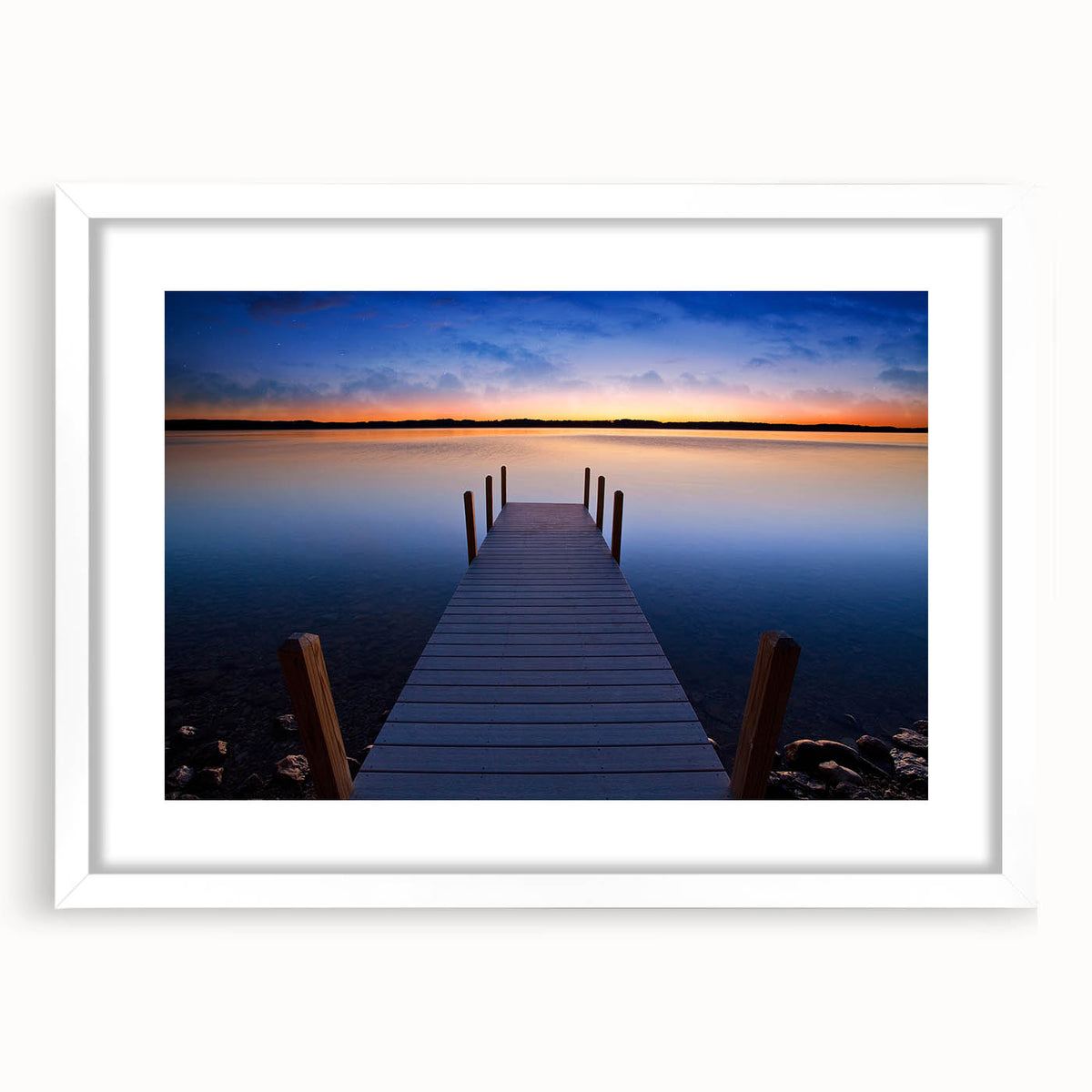 Abstract art print of Lake Michigan with muted blue and gray tones on a framed white mat.