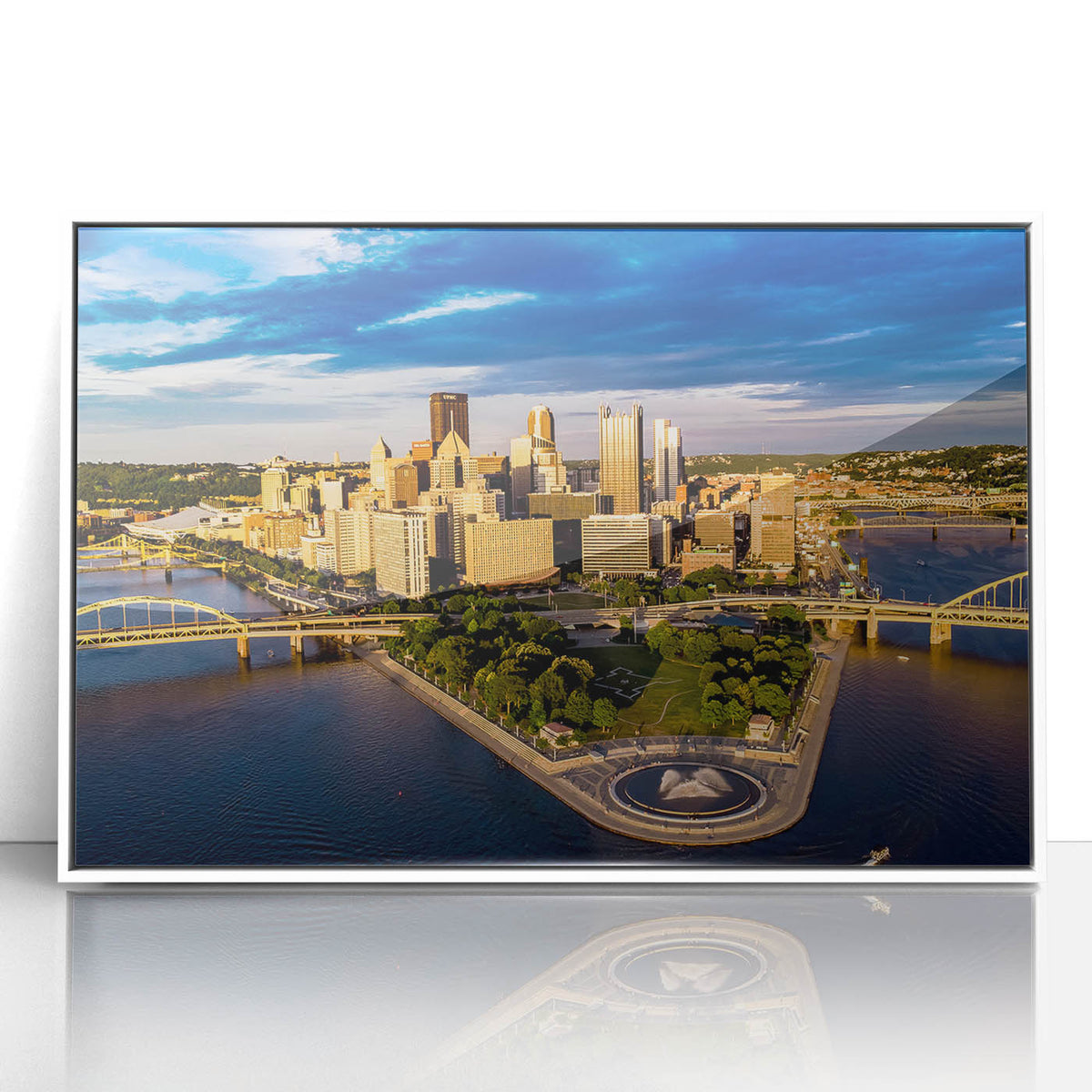Art deco style poster of Pittsburgh skyline in muted gray and blue tones on a white framed acrylic.