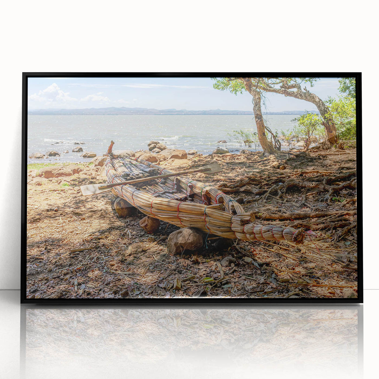 Large abstract wall art depicting an Ethiopian landscape in muted earth tones, framed in black acrylic.