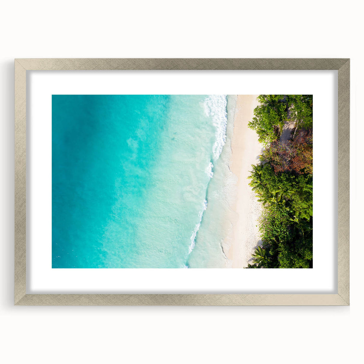 Textured abstract art print depicting Seychelles scenery in muted blue and green tones, framed with a silver mat.