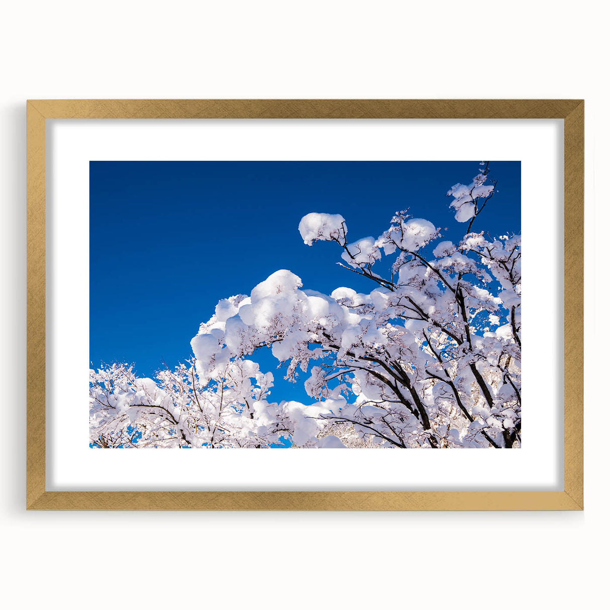 Abstract art print featuring textured strokes in gold and black on a large canvas, ideal for living room decor.