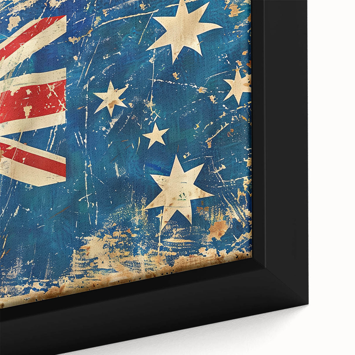 Close-up of a framed canvas depicting Ayers Rock in Australia, featuring textured black and colorful art.