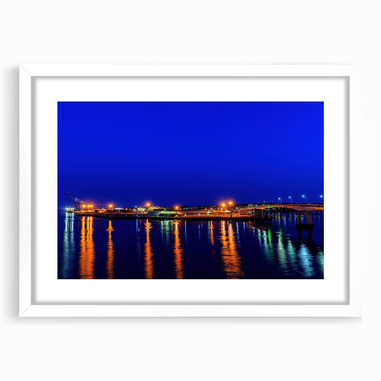 Abstract art print of New Brunswick scenery in muted earth tones on a white framed mat, suitable for dining room decor.