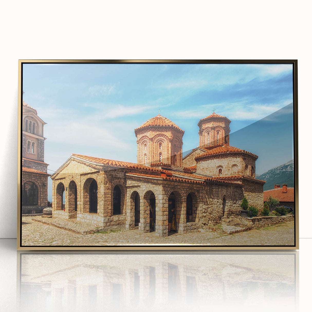 Art deco poster of a European Albanian scenery in muted gold tones, framed in acrylic, suitable for modern art wall decor.