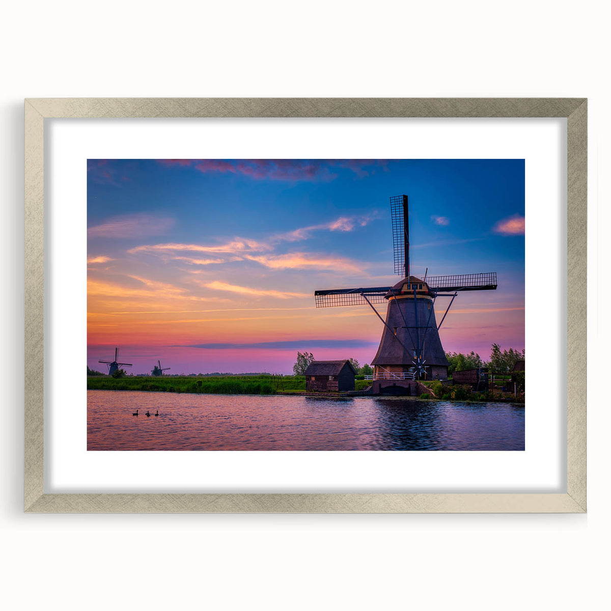 Extra large abstract art print depicting a textured European scenery in muted earth tones, framed in silver.