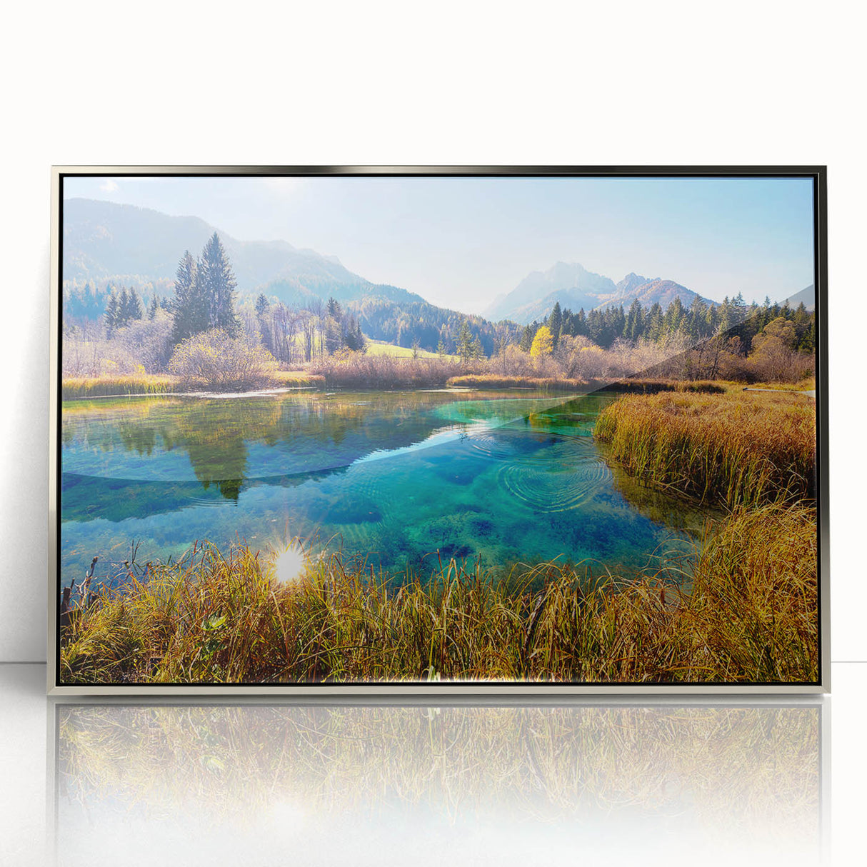 Art deco poster of a Slovenian landscape in muted greens and blues, framed in silver acrylic.