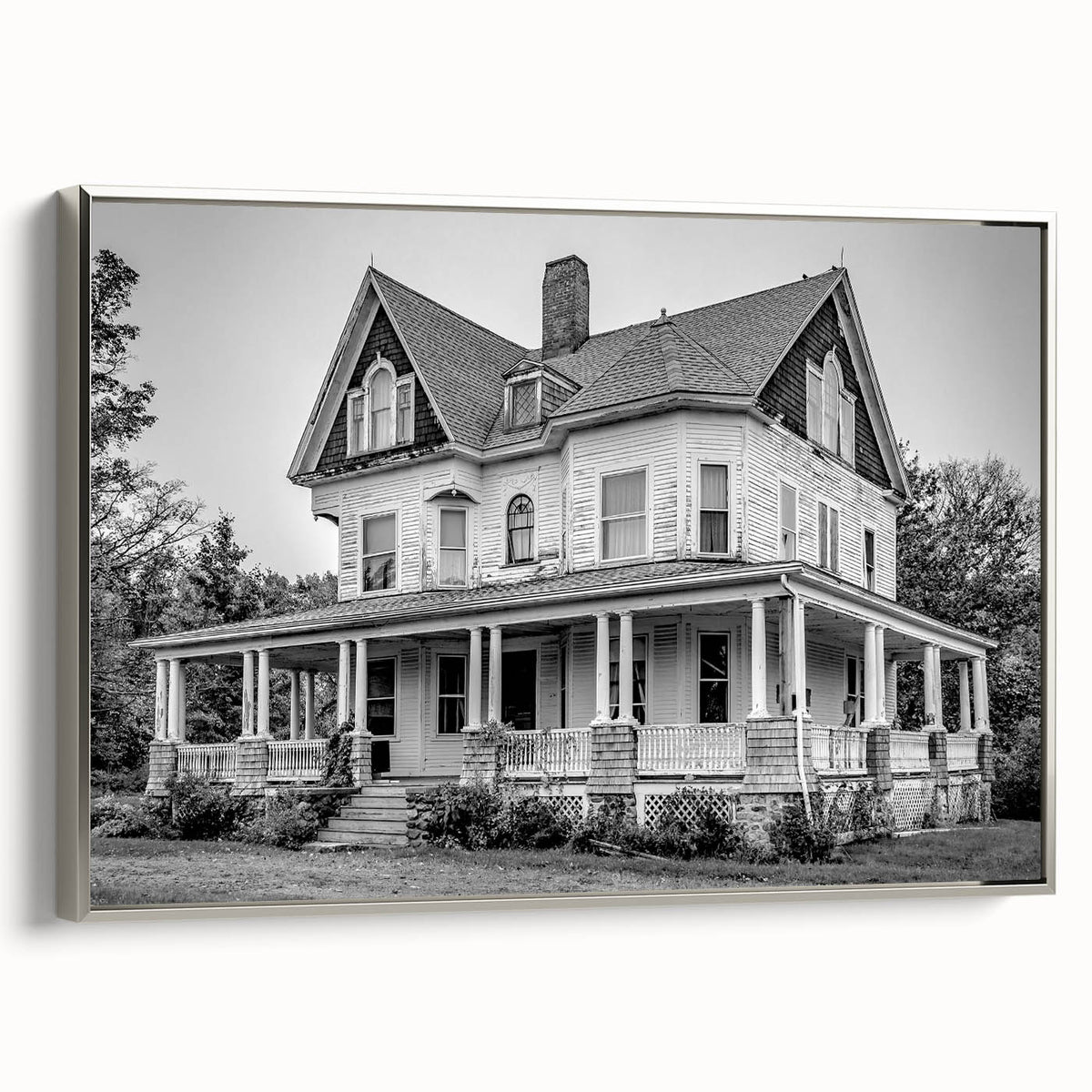 Framed canvas featuring a vintage-style Connecticut landscape in black with colorful accents, ideal for living room decor.