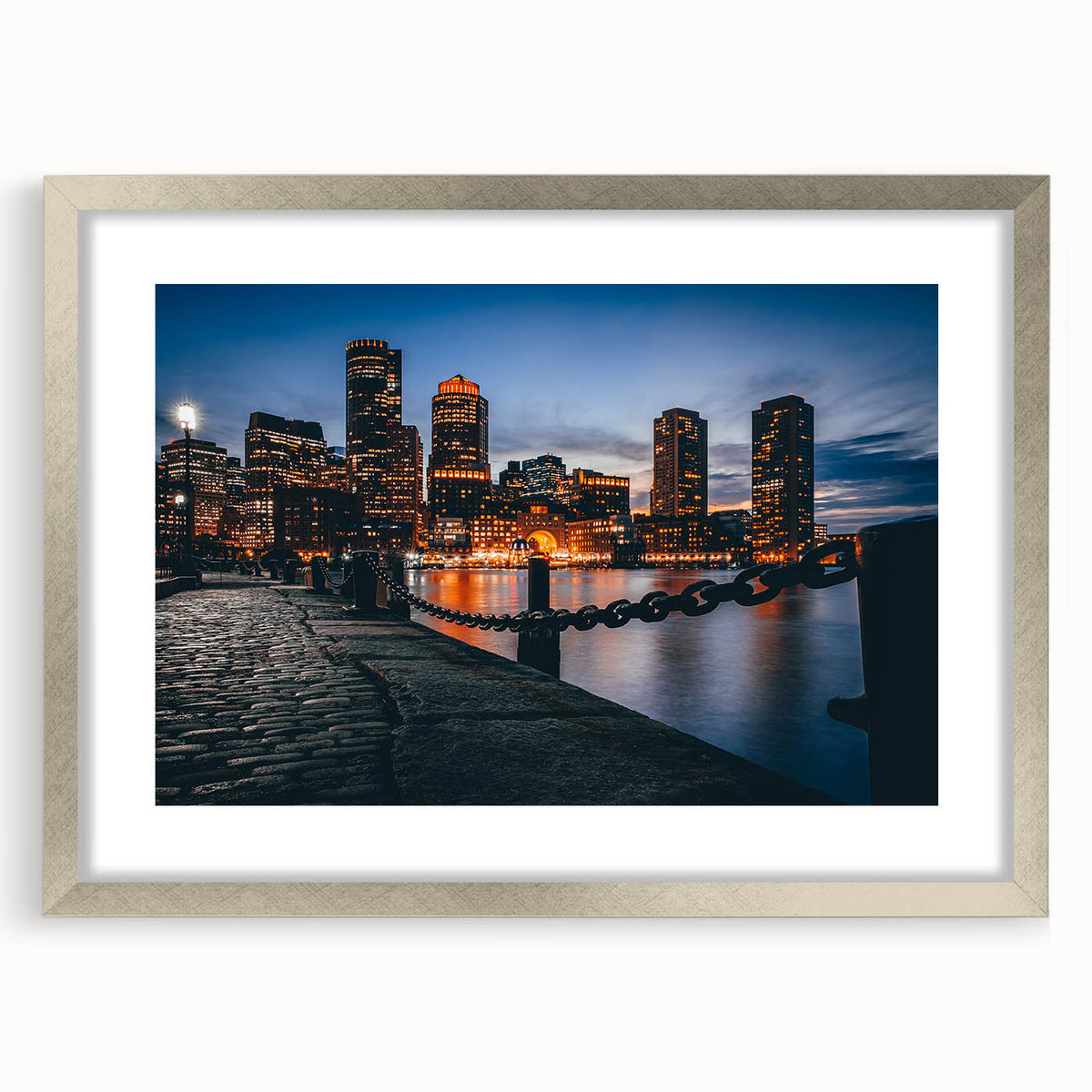 Textured art print of abstract Boston skyline in muted gray and blue tones, framed in silver, ideal for bedroom art.
