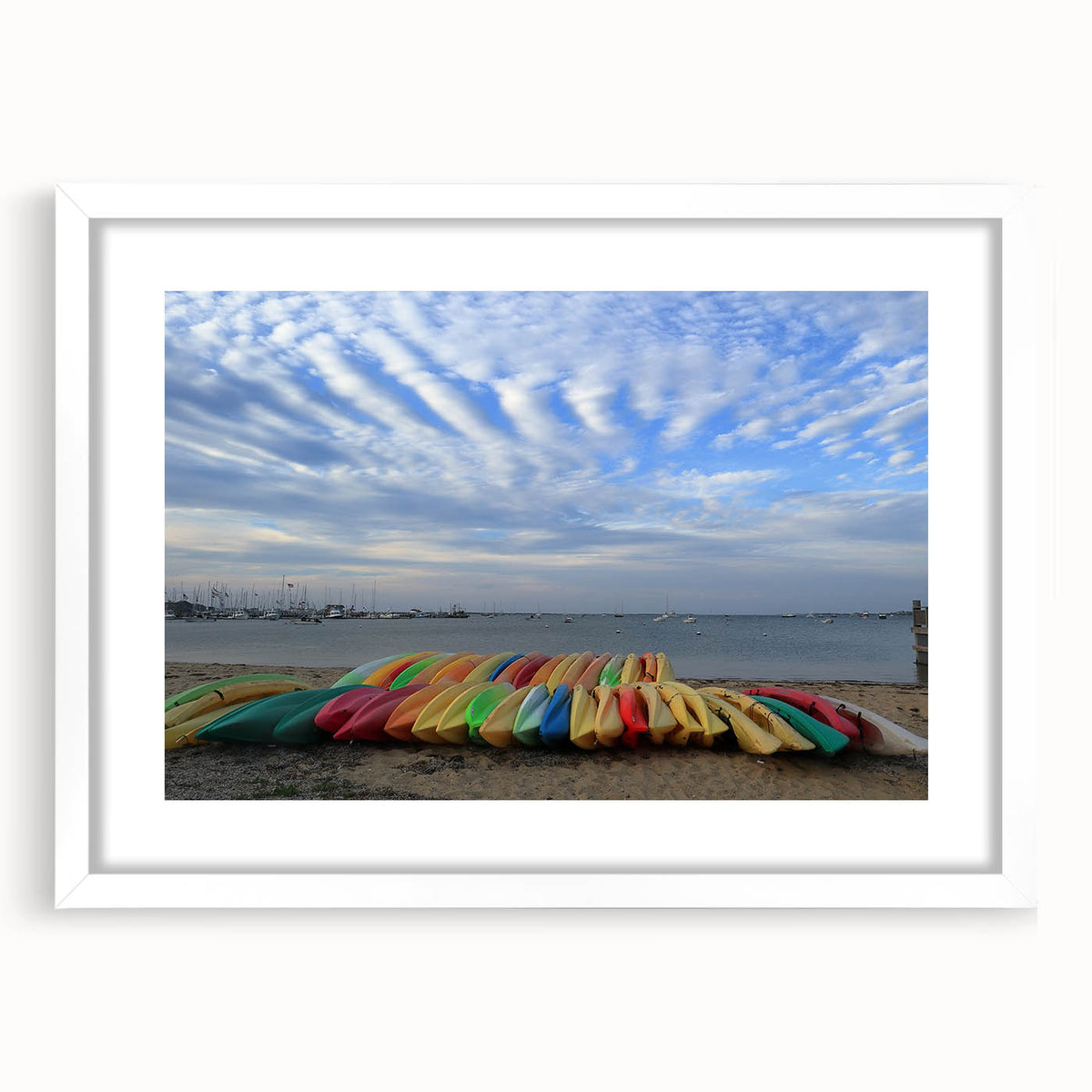 Abstract art print of Nantucket scenery in muted blue tones on a white framed poster, suitable for dining room decor.
