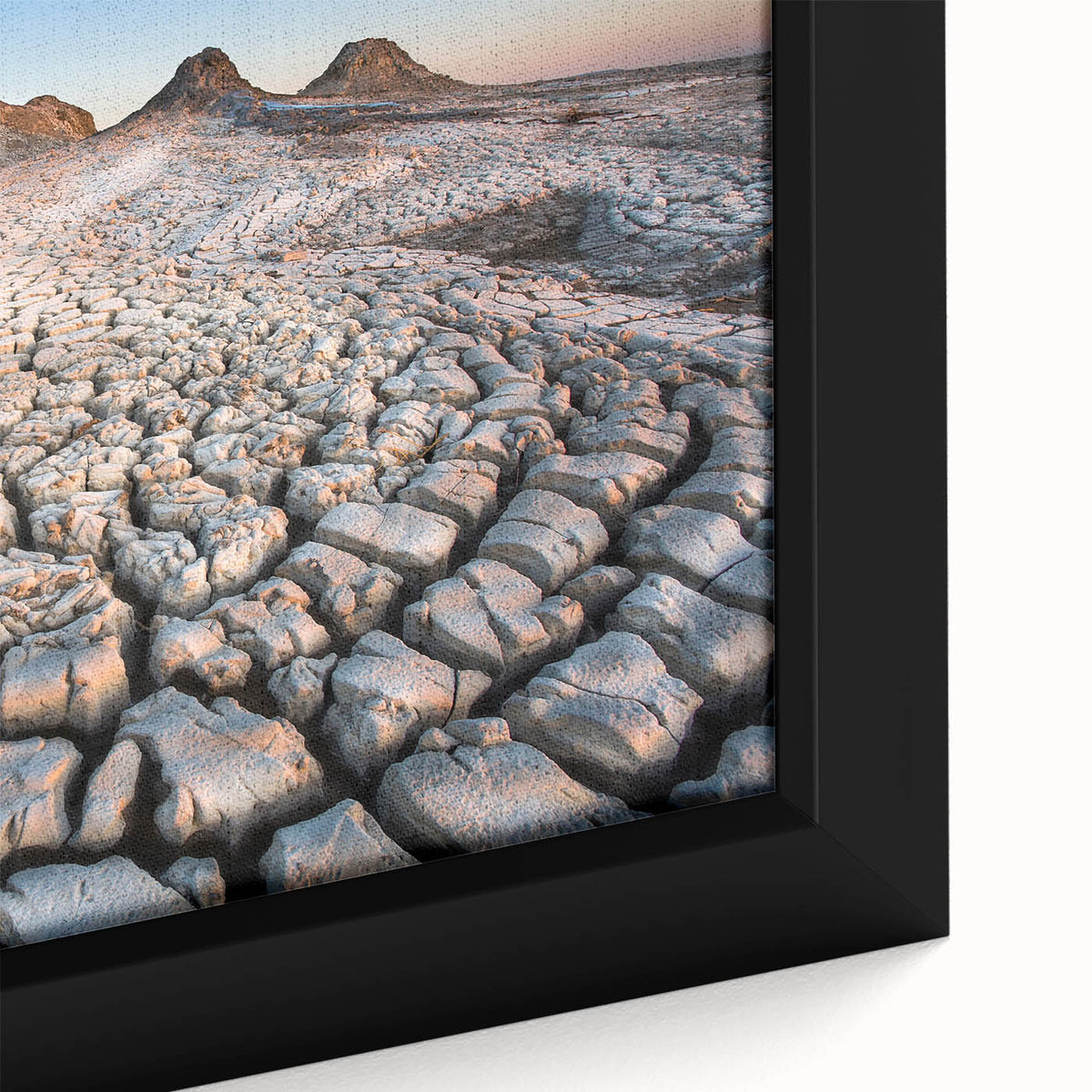 Close-up of a textured black wall art featuring colorful, abstract scenery on a framed canvas, ideal for living room decor.
