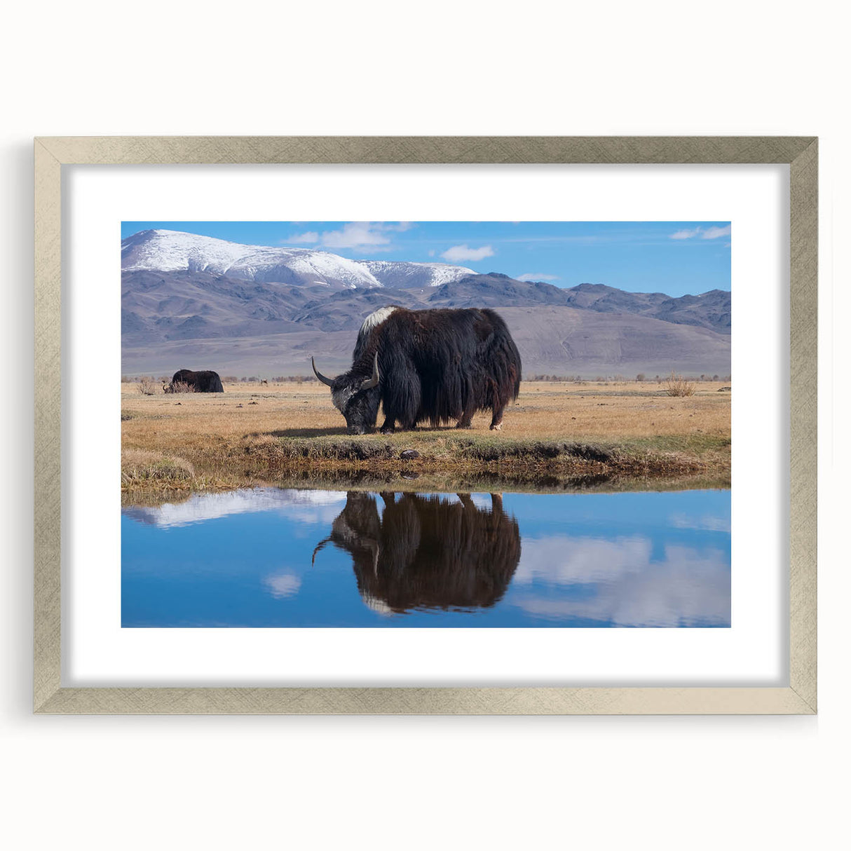 Textured art depicting abstract Tibetan landscape in muted earth tones on a framed silver mat, suitable for bedroom decor.